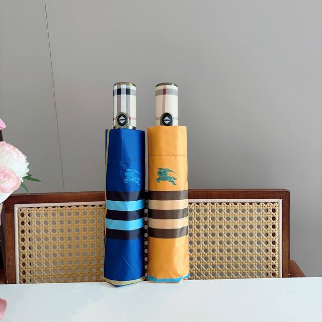 Burberry's tri-fold, self-folding umbrella is the pinnacle of the year. Classic,