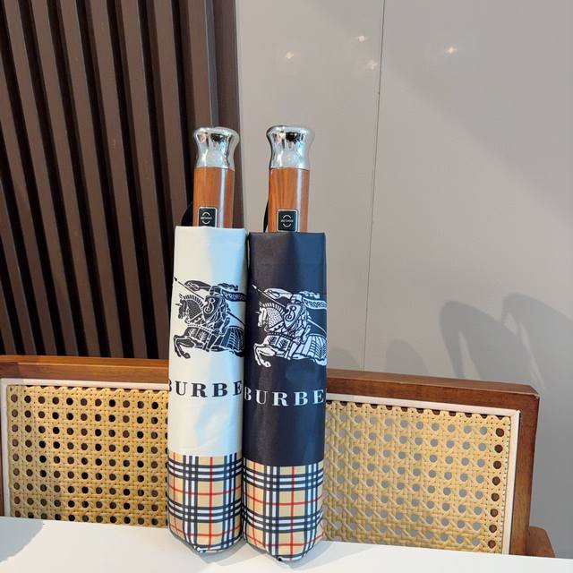 Burberry's tri-fold, self-folding umbrella is the pinnacle of the year. Classic,
