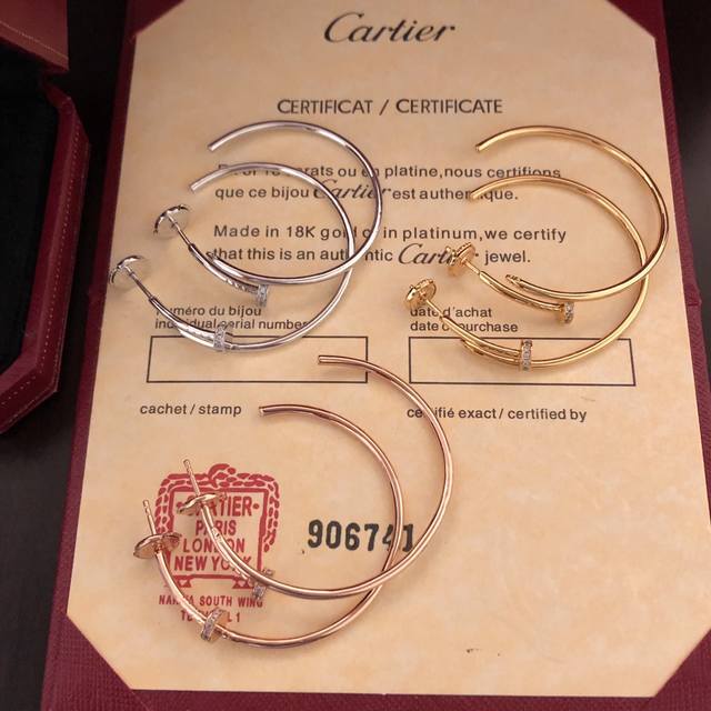 The exquisitely crafted Cartier Juste Un Clou half-diamond nail earrings, craft