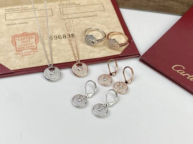 Cartier necklace, earrings, and ring. Cartier amulet full diamond necklace, ear