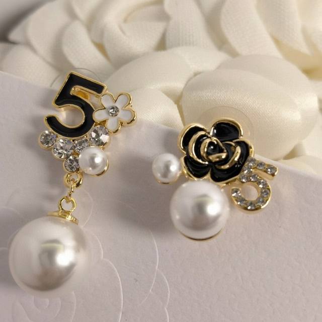 Chanel I really like this design of Chanel's No. 5 camellia earrings with diamon