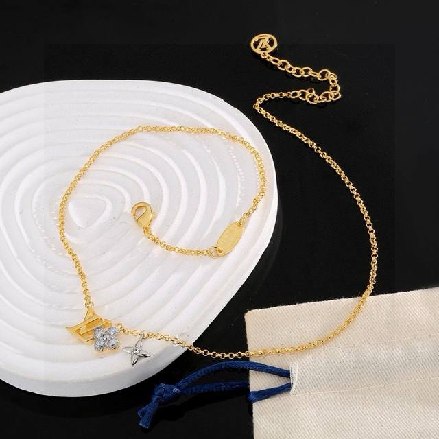 The exquisitely crafted Louis Vuitton letter flower necklace can be worn in two