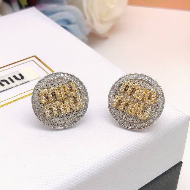 No. Med0010 Miu Miu round earrings with diamond logo and gold DDD