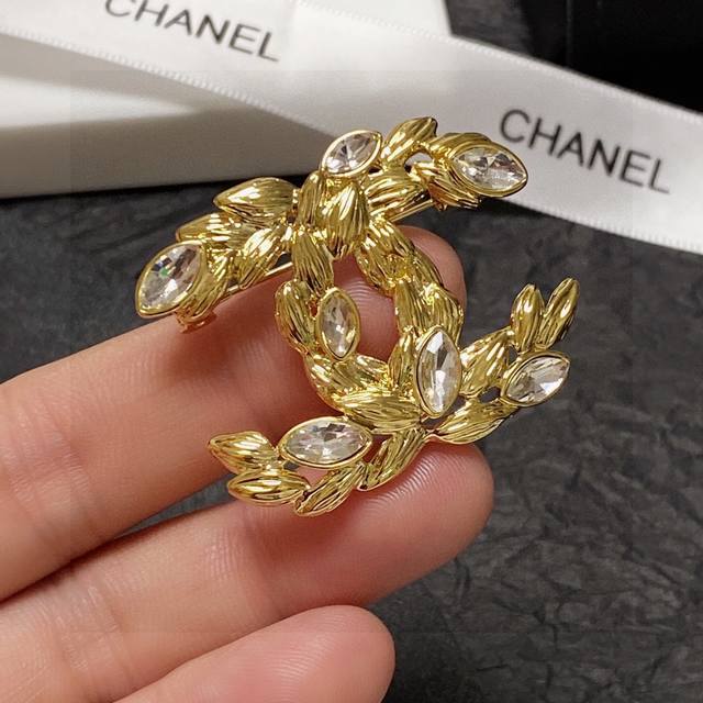 Chanel's new wheat-ear diamond-encrusted brooch is a truly feminine accessory. W