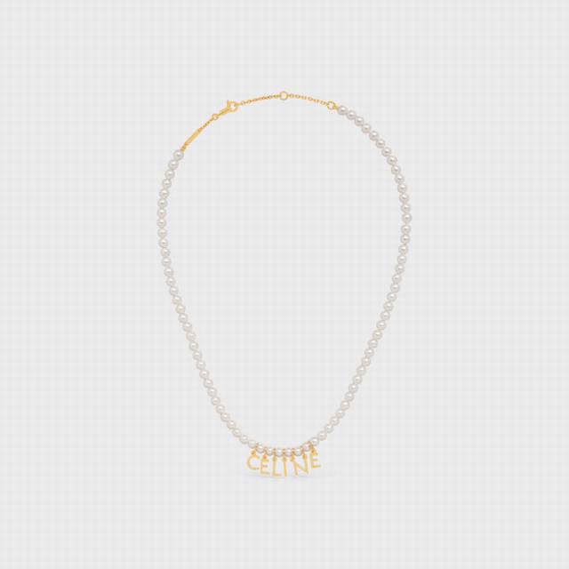 Celine Celine pearl letter necklace. The small pearls are paired with the small