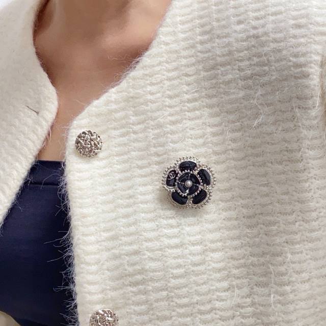 Chanel's new Camellia brooch is a truly feminine accessory. Women who dedicate t