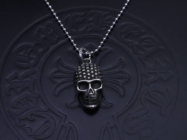 Chrome Hearts necklace and Buddhist beads. The skull represents a new beginning,
