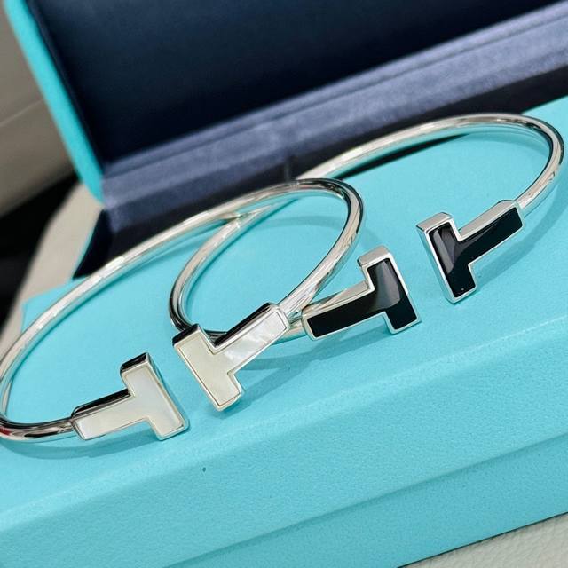 T's new wide, large double-T white mother-of-pearl and black ceramic spring brac