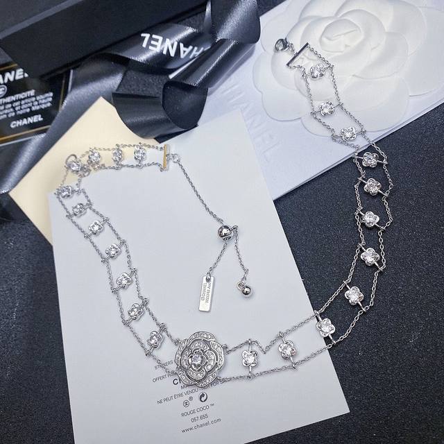 Chanel's popular camellia chain necklace in V-gold. What woman can resist this c