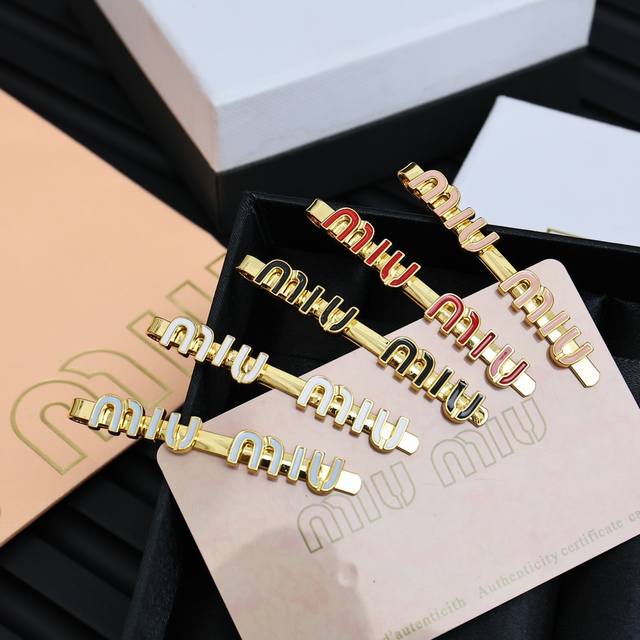 Miumiu candy-colored enamel hairpin Miumiu's logo design elements, minimalism, n