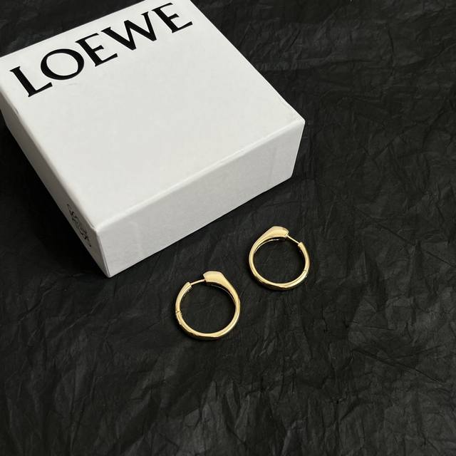 L0Ewe Loewe earrings, and a ring buckle with Loewe carved diamond buckle, exquis