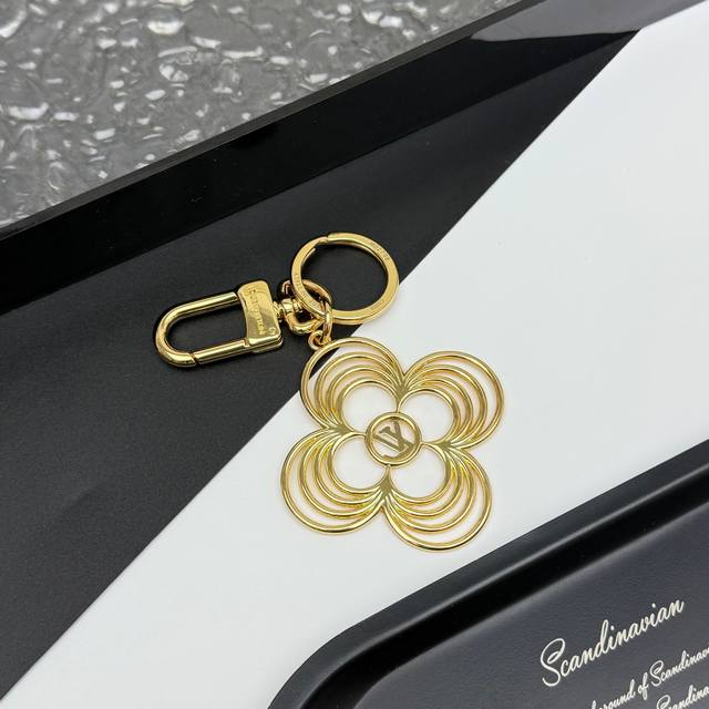 The Lv Breeze keychain features a gentle floral design, perfect for brightening