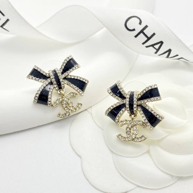 Chanel's hot-selling earrings are now available! Chan 25 Black and Gold Bow Dou