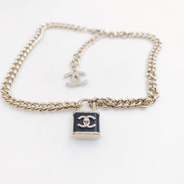Chanel latest light gold black lock necklace consistent with the Z batch brass m