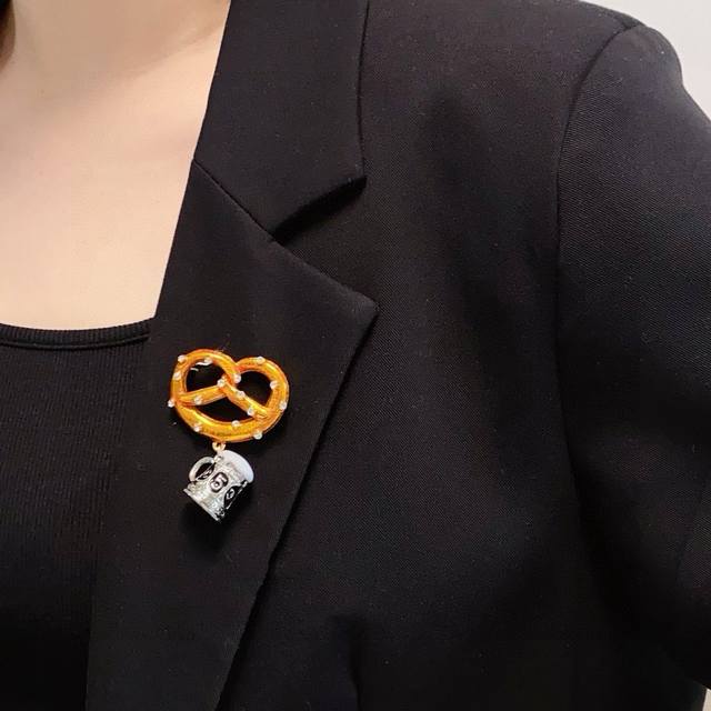 Chanel's new bread knot, vintage lye knot, beer mug, and Chanel brooch are acces
