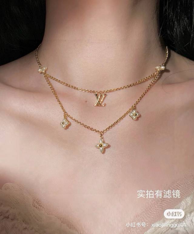 This exquisitely crafted Louis Vuitton letter necklace, crafted with exquisite