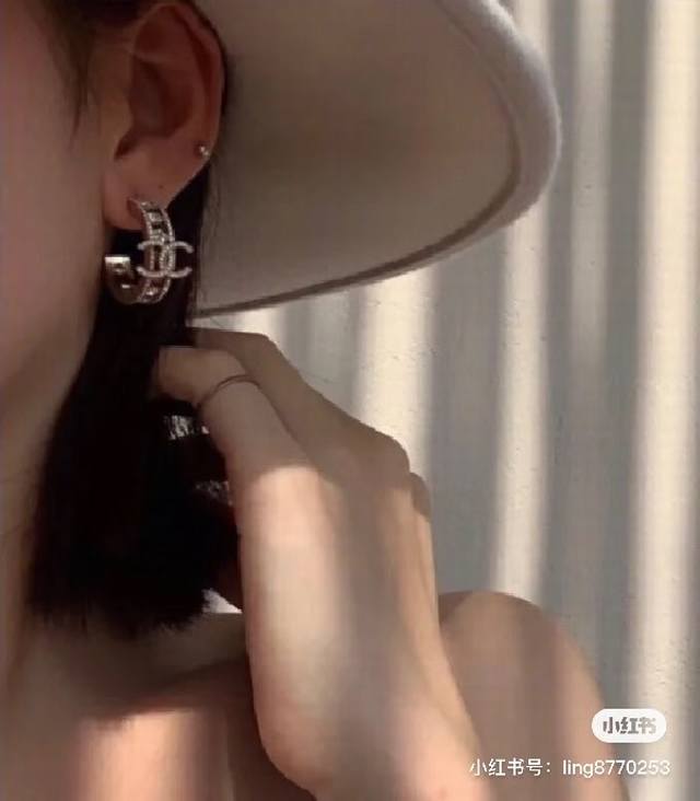 Chanel full diamond double C half hoop earrings with light gold as the main col