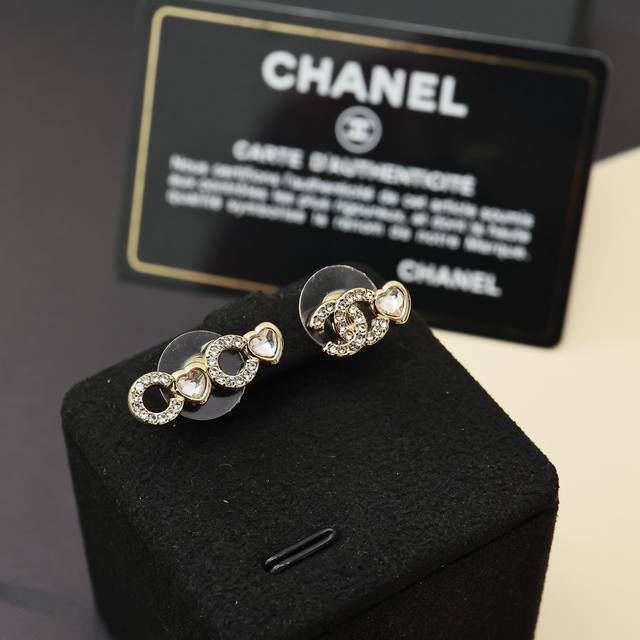 Chanel 25B new asymmetrical heart earrings with light gold as the main color, s