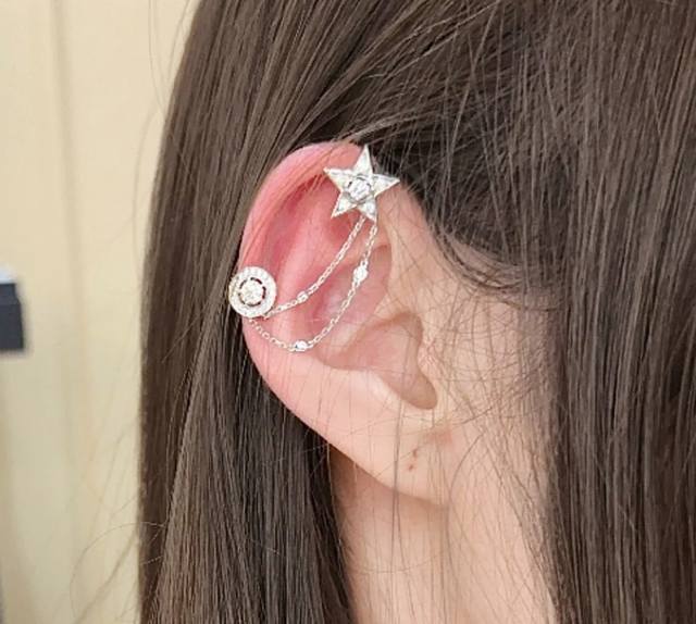 V Gold Material Single Chanel Star Earrings. A single piece of jewelry holds cou