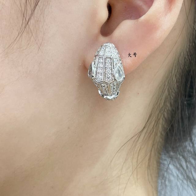 Available price: Bulgari large white-eyed snake earrings, inlaid with pav