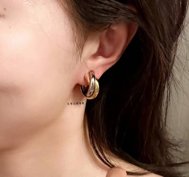 V Cartier Large Three-Hand Earrings in Gold, another classic, the encircling inl