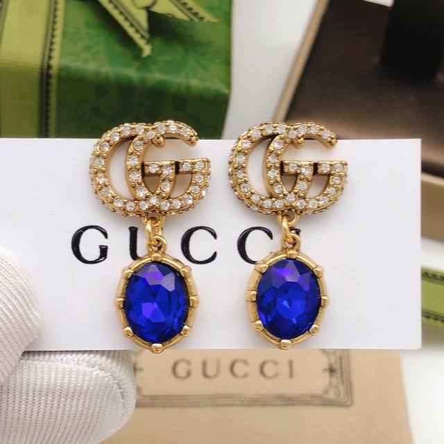 No. Ged165 Gucci Double G blue stud earrings. The recognizable Double G logo is
