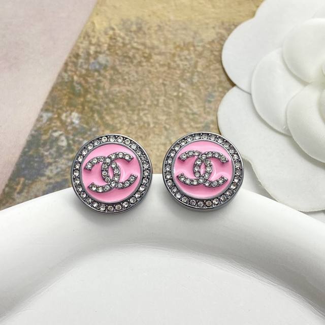 Chanel's best-selling earrings are back! The Chan 25 round earrings with black