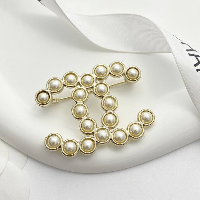 Chanel brooches are hot sellers! Chan 24 Pearl Double C Brooch. This classic do