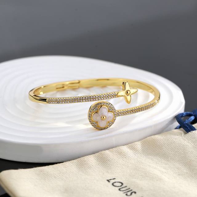 This exquisitely crafted, minimalist Louis Vuitton bracelet, crafted with exqui
