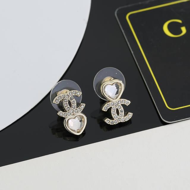 Chanel's new heart-shaped earrings are perfect for flattering your face. Surrou