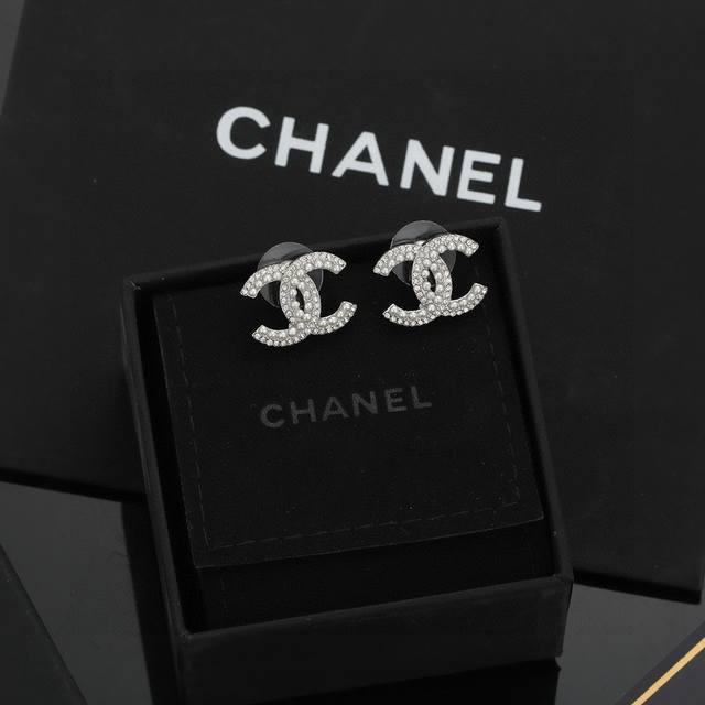 Chanel Double C earrings are cleverly embellished on both sides of the earlobes