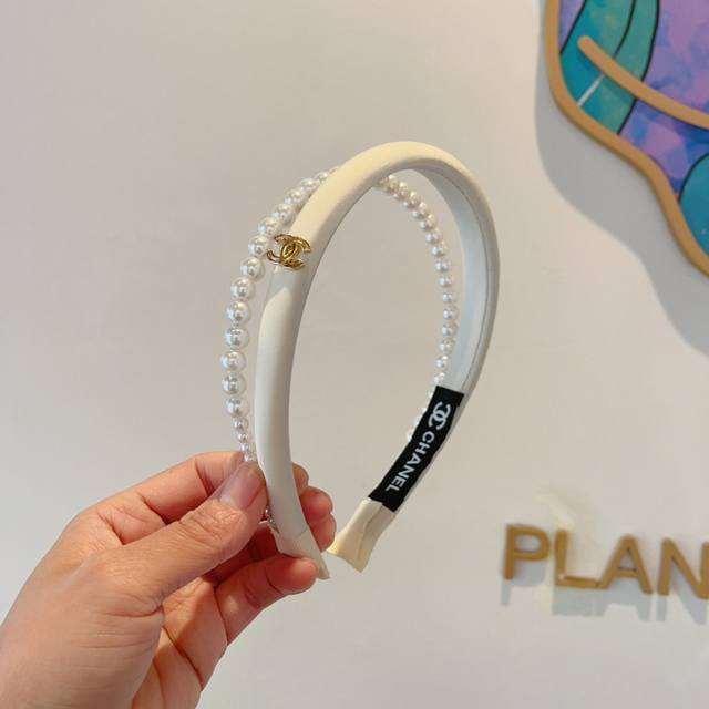 with packaging Chanel's latest small pearl headband, a new product that makes y