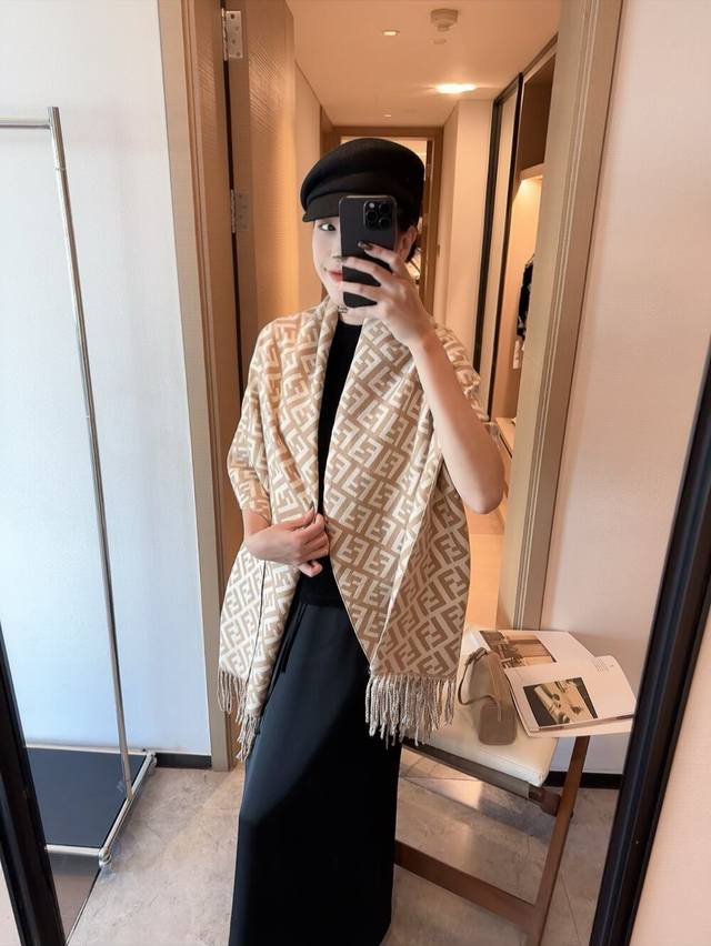 Fendi's latest scarf features a super soft and stylish double-sided design! It f