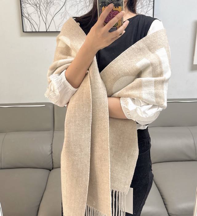 I'm really crazy about this Jacquemus double-sided scarf this year. I absolutel