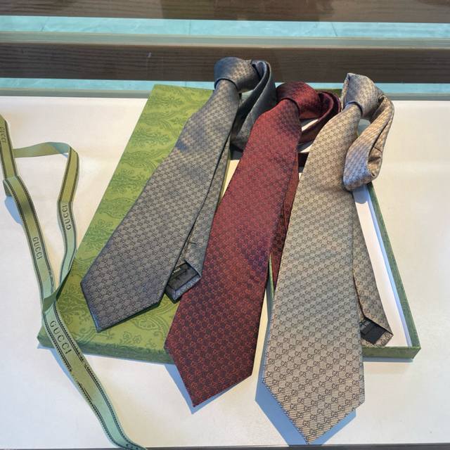 New G-branded men's tie. This rare, classic G logo jacquard tie showcases exqui