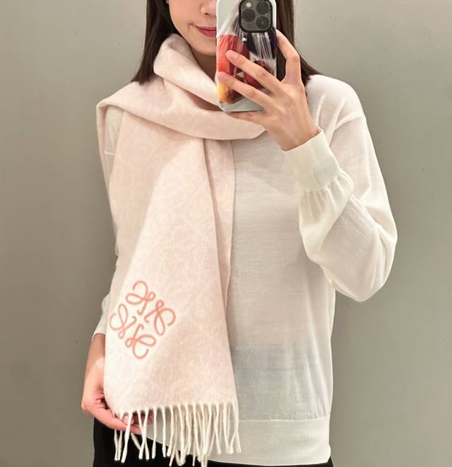 is Loewe's latest and hottest scarf for 2025. This double-faced wool and cashme