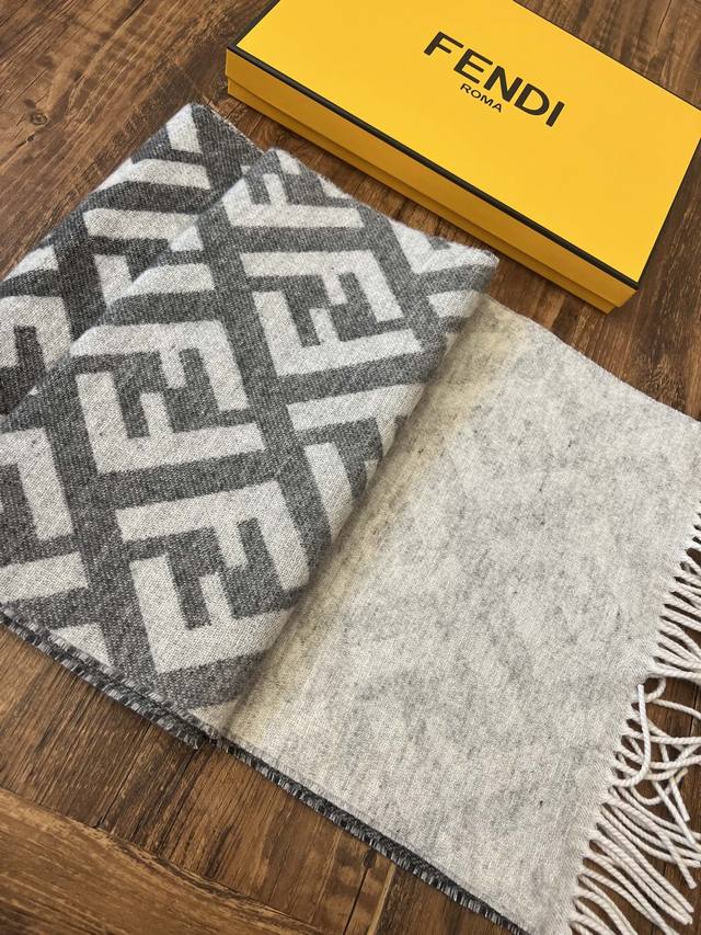 Fendi's latest Big F gradient double-sided scarf in gray. Size: 35 x 190 cm. Mad