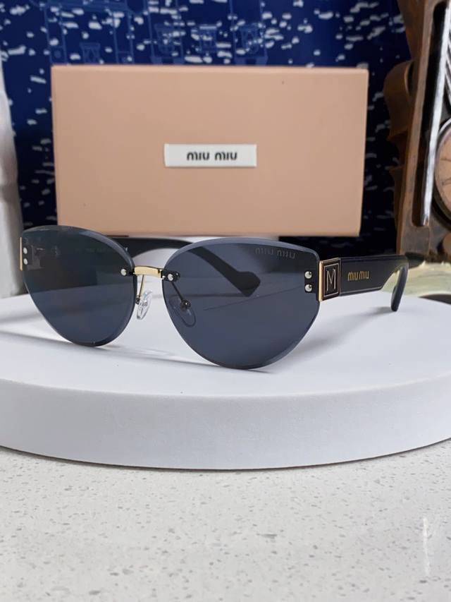 Miumiu 2025 new frameless sunglasses for women retro round face-shaping sunshade