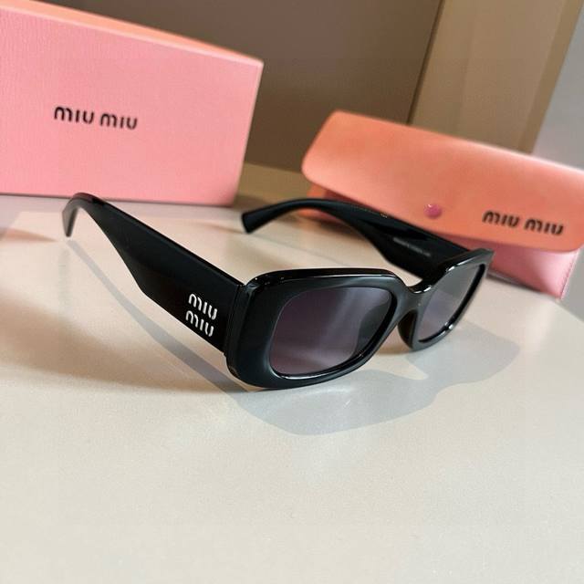 Miumiu sunglasses Black and white with logo is always the perfect match. Summer