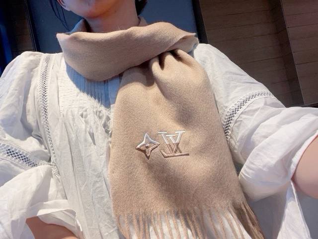 Louis Vuitton. This embroidered cashmere scarf is a must-have! A rare, high-end