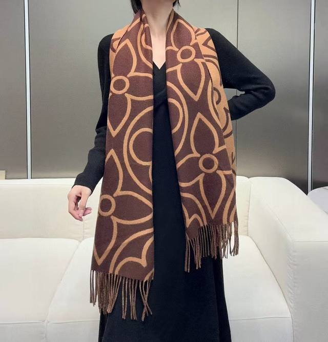 The Lv In Bloom scarf showcases a large Monogram flower in a wide format, expre