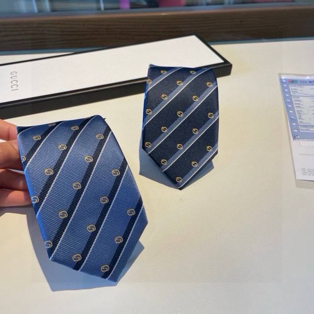 G's new men's tie, featuring a rare jacquard pattern with the classic G logo, sh