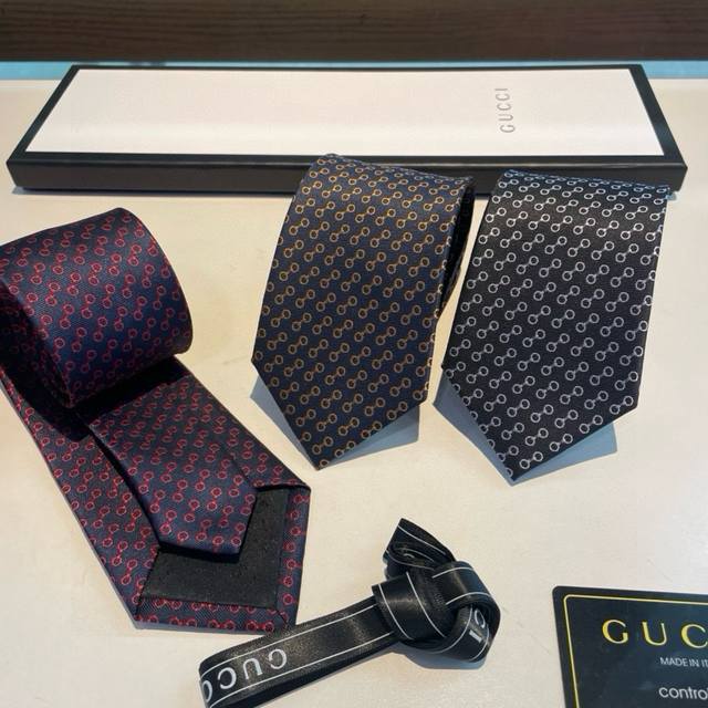 G's new men's tie, featuring a rare jacquard pattern with the classic G logo, sh