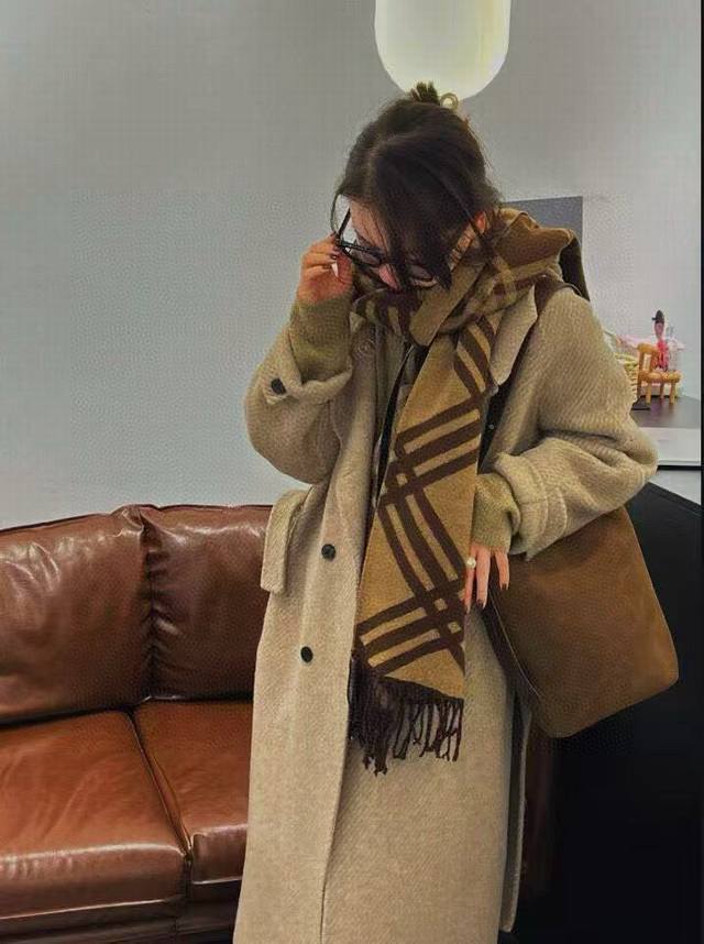 Burberry's new Scottish check cashmere scarf. Following the check scarf that Ju