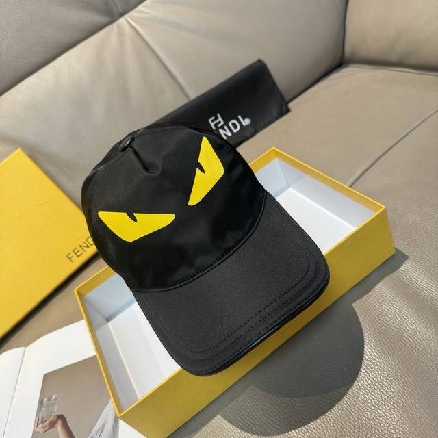 comes with a box bag. This new Fendi baseball cap features a "little monster" l