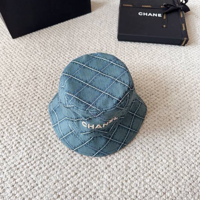 Chanel's new denim blue retro bucket hat is a great vintage hat for holidays. Th