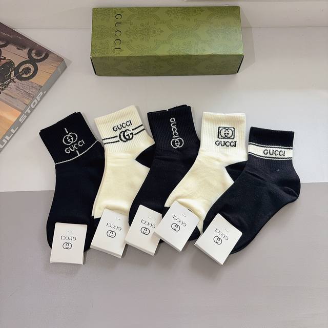 comes with a box of 5 pairs of Gucci's new mid-calf socks! Pure cotton fabric,
