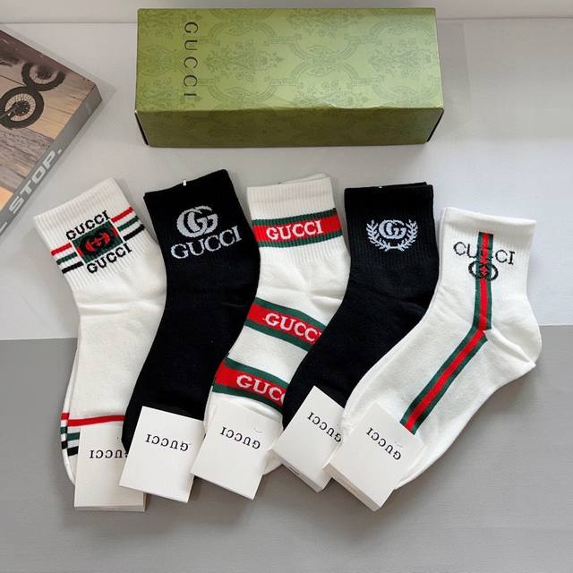 comes with a box of 5 pairs of Gucci's new mid-calf socks! Pure cotton fabric,