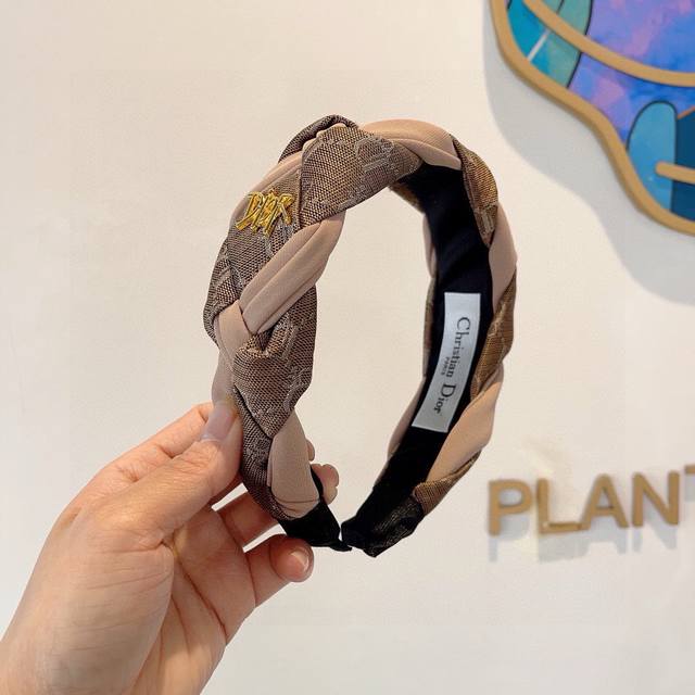 with packaging Dior's new wide-brimmed, high-end headband, a popular online fav