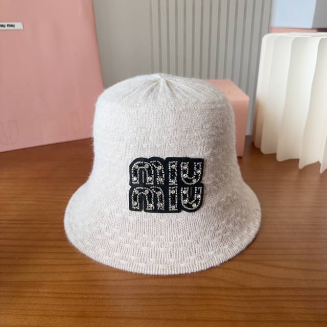 Miumiui Miu Miu knitted striped bucket hatThe soft and sticky striped bucket hat